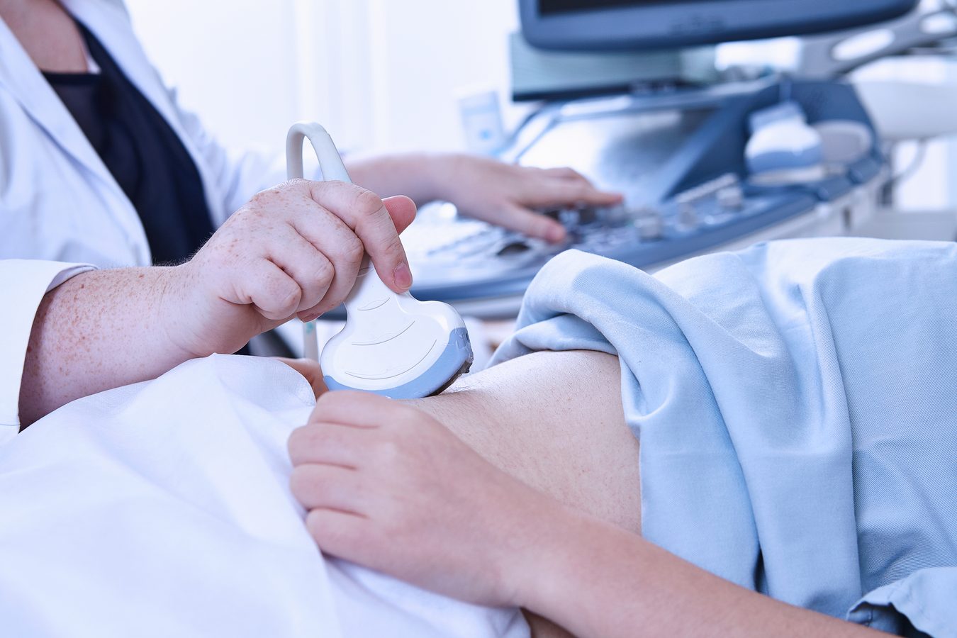 Diagnostic medical sonographer performing ultrasound examination